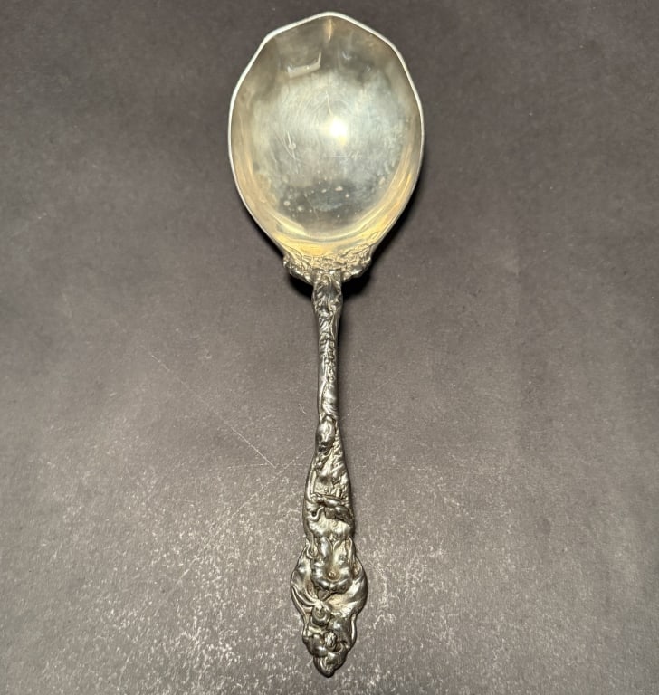 Art Nouveau Sterling Silver Serving Spoon: 9 3/4" lengthApprox. 6 Ozt.The Estate of the late Judy Boyd, New Jersey.STERLING ASSOCIATES STRIVES TO PROVIDE ACCURATE, OBJECTIVE, & FAIR INFORMATION ON ALL LOTS. WE WILL BE HAPPY TO ANSWER ANY QUEST