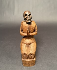 Carved Praying Skull Figure