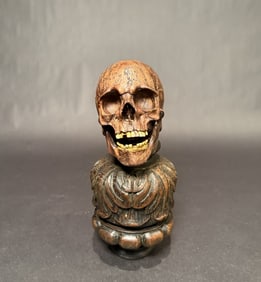 Carved And Mounted Articulating Skull