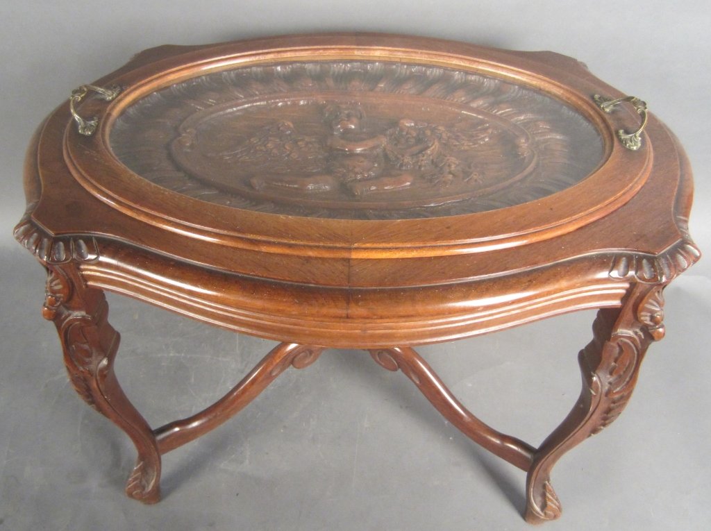 Carved Walnut Table w/ Removable Tray: High relief carved walnut table with removable glass and wood framed tray. circa 1920 Height: 18", Width: 24"