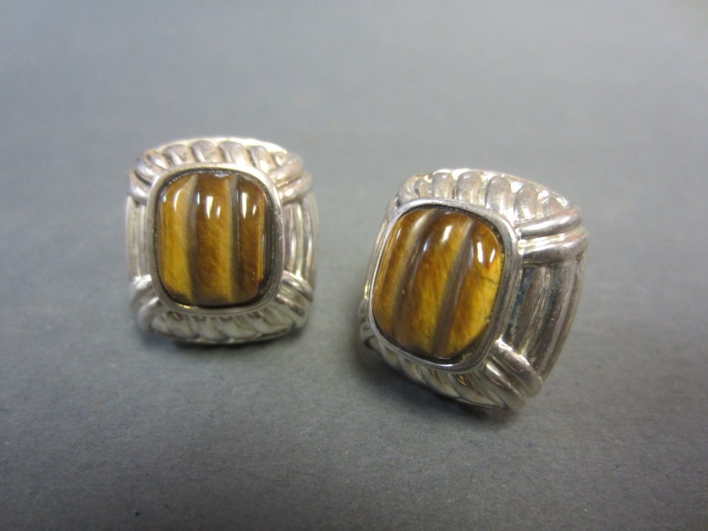 Judith Ripka Sterling & Tiger's Eye Earrings: Sterling and carved tiger's eye earrings by Judith Ripka Height: 3/4", Width: 3/4"