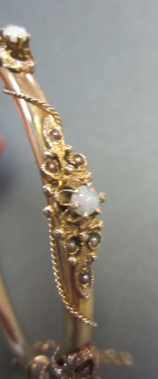 14Kt, Pearl and Opal Bangle Bracelet: 14Kt, pearl and opal bangle bracelet.