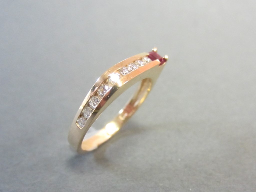 14Kt, Diamond & Ruby Ring: 14Kt, diamond and ruby ring. approx total weight 3 grams
