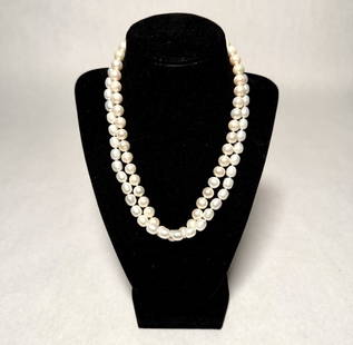 Collection Of 2 Pearl Necklaces: 2 pearl necklaces with yellow gold clasps marked 14K .Length approx. 18". Bead dia. approx. 8.2- 9.2mm.STERLING ASSOCIATES STRIVES TO PROVIDE ACCURATE, OBJECTIVE, & FAIR INFORMATION ON ALL LOTS. WE