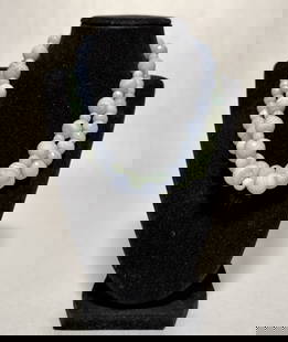 Collection Of 2 Jade Necklaces: Jade beaded necklaces with yellow gold clasps marked 14K. Length approx. 17.5". Beads dia. approx. 8.3-19.1mm.STERLING ASSOCIATES STRIVES TO PROVIDE ACCURATE, OBJECTIVE, & FAIR INFORMATION ON ALL