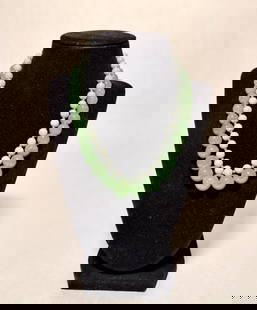 Collection Of 2 Jade Necklaces: Light and darker green jade beaded necklaces and 14k gold beaded necklaces.Yellow gold clasps marked 14K. Length approx. 16.5" and 17.5". Beads dia. approx. 2.9-14.1mm.STERLING ASSOCIATES STRIVES TO