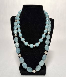 Collection Of 2 Pearl And Semi-Precious Necklaces: Blue quartz, pearls and semi-precious stone beaded necklaces.Yellow gold clasps marked 14K. Length approx. 18" and 23". Beads dia. approx. 2.9-13.5mm.STERLING ASSOCIATES STRIVES TO PROVIDE ACCURATE,