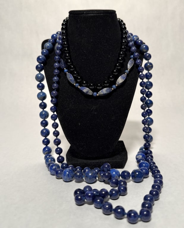 Collection Of 4 Lapis And Onyx Necklaces: Beaded lapis lazuli, onyx, sodalite and 14k necklaces. Yellow gold clasp marked 14K.Length approx. 16", 17", 32" and 38.5". Beads dia. approx. 2.9-20.6mm.STERLING ASSOCIATES STRIVES TO PROVIDE ACCURAT