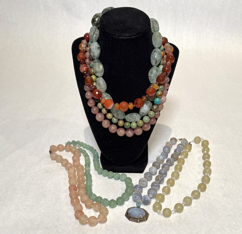 Collection Of 8 Jade And Quatrz Necklaces: Garved jade and quartz beaded necklaces with sterling silver clasps. Marked sterling and 925. Lengths approx. 2@19", 2@ 18", 3@ 17', 1@ 16". Beads dia. approx. 8.0mm-16.0mm. Pendant approx. 1.4' x 1.2