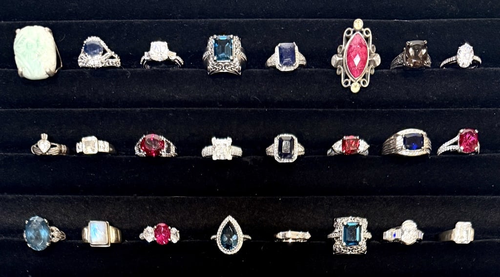 Colledtion Of 24 Sterling Silver Rings: Sterling siver and various semi-precious stones. Marked 925 and sterling.Ring sizes 5.5-11.5. Most 6.25 and 6.5. Gross weight approx.143 grams.STERLING ASSOCIATES STRIVES TO PROVIDE ACCURATE, OBJECTIV