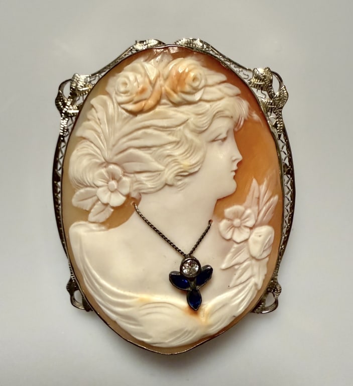 14K White Gold And Diamond Cameo Brooch Pin: Approx. dimensions 2" x 1 1/2". Marked 14K. Approx. gross weight 15.9 grams. STERLING ASSOCIATES STRIVES TO PROVIDEACCURATE, OBJECTIVE, & FAIR INFORMATION ON ALL LOTS. WE WILL BE HAPPY TO ANSWER ANY Q
