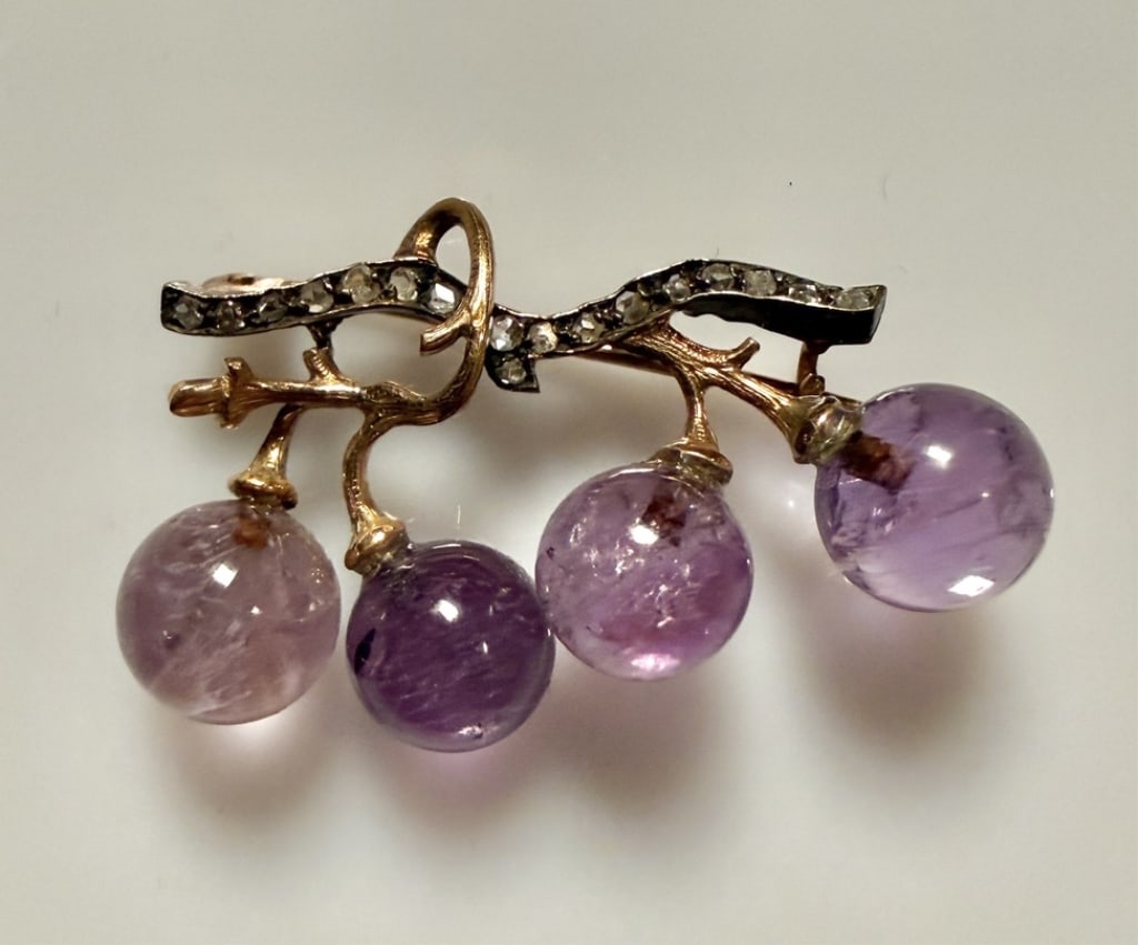 14K Gold, Diamond and Amethyst Quartz Brooch Pin: Approx. dimensions 1 3/8" x 3/4". Tested 14K. Approx. gross weight 7.3 grams. STERLING ASSOCIATES STRIVES TO PROVIDEACCURATE, OBJECTIVE, & FAIR INFORMATION ON ALL LOTS. WE WILL BE HAPPY TO ANSWER ANY 