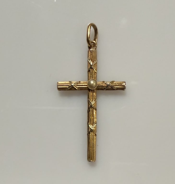 14K Gold And Pearl Cross Pendant: Approx. dimensions 1" x 1 3/4" including bail. Tested 14K. Approx. gross weight 1.0 grams.STERLING ASSOCIATES STRIVES TO PROVIDE ACCURATE, OBJECTIVE, & FAIR INFORMATION ON ALL LOTS. WE WILL BE HAPPY T