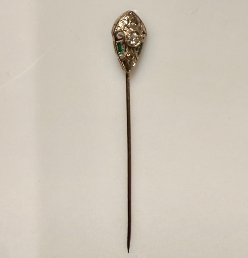 14K White Gold, Diamond And Emerald Art Deco: Stickpin Approx. dimensions 5/8" x 3/8". Tested 14K. Approx. gross weight 1.6 grams.STERLING ASSOCIATES STRIVES TO PROVIDE ACCURATE, OBJECTIVE, & FAIR INFORMATION ON ALL LOTS. WE WILL BE HAPPY TO ANSW