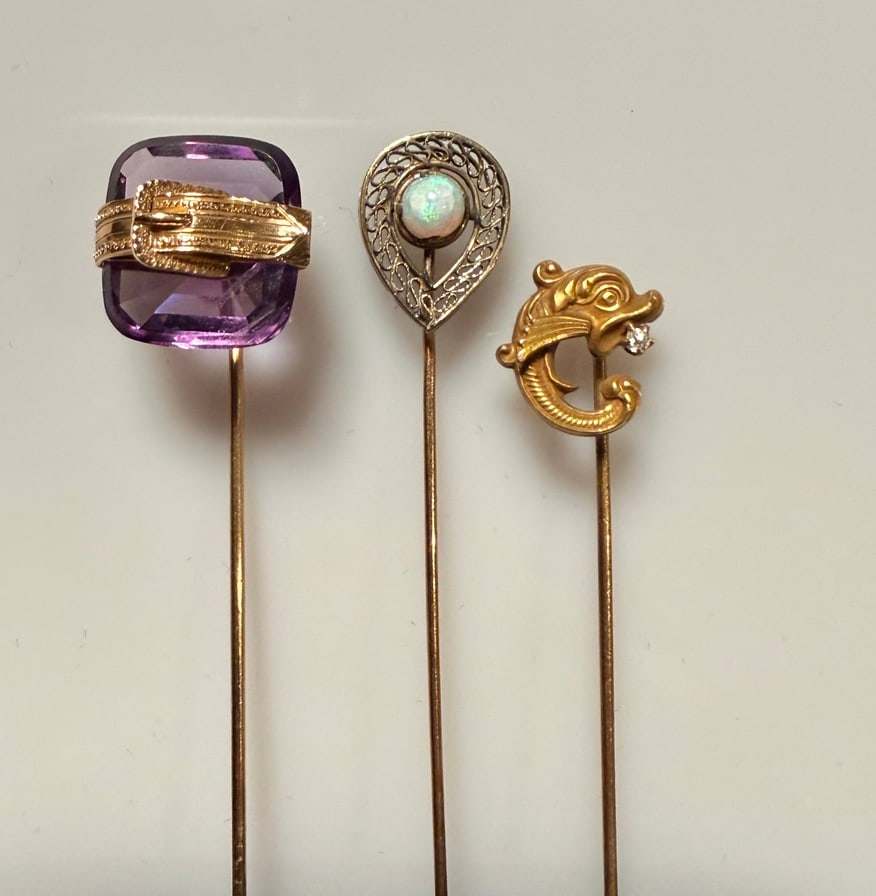 14K Gold And Gemstone Stickpins (3): Approx. dimensions 5/8" x 5/8" amethyst. Marked and tested 14K. Approx. gross weight 5.6 grams. STERLING ASSOCIATES STRIVES TO PROVIDEACCURATE, OBJECTIVE, & FAIR INFORMATION ON ALL LOTS. WE WILL BE HA