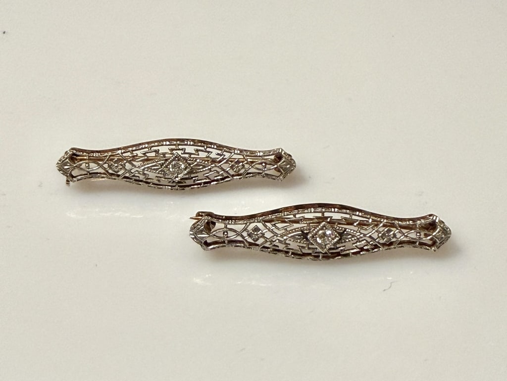 14K Gold And Diamond Art Deco Two Tone Brooch Pins: Pair (2) Approx. dimensions 1 1/4" x 1/4". Marked 14K. Approx. gross weight 3.0 grams.STERLING ASSOCIATES STRIVES TO PROVIDE ACCURATE, OBJECTIVE, & FAIR INFORMATION ON ALL LOTS. WE WILL BE HAPPY TO AN