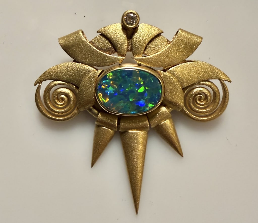 18K Gold, Diamond And Opal Art Deco Style Brooch: Pin Approx. dimensions 1 3/4" x 1 3/4". Tested 18K. Approx. gross weight 17.2 grams. STERLING ASSOCIATES STRIVES TO PROVIDEACCURATE, OBJECTIVE, & FAIR INFORMATION ON ALL LOTS. WE WILL BE HAPPY TO ANSW