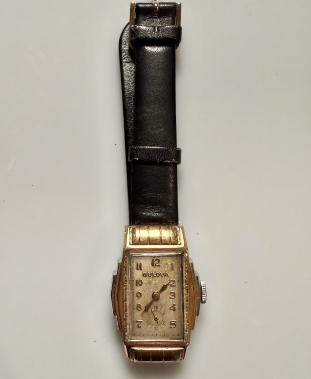 Bulova Art Deco Mens Watch: Marked 10K rolled gold plate. 1 3/4' x 1' case. STERLING ASSOCIATES STRIVES TO PROVIDEACCURATE, OBJECTIVE, & FAIR INFORMATION ON ALL LOTS. WE WILL BE HAPPY TO ANSWER ANY QUESTIONS AND PROVIDE ADDITION