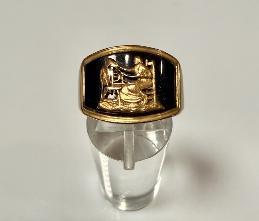 18K Gold And Enamel Figural Ring: Ring size 6 1/2. Marked 18K an engraved. Approx. gross weight 13.7 grams. STERLING ASSOCIATES STRIVES TO PROVIDE ACCURATE, OBJECTIVE, & FAIR INFORMATION ONALL LOTS. WE WILL BE HAPPY TO ANSWER ANY QUES