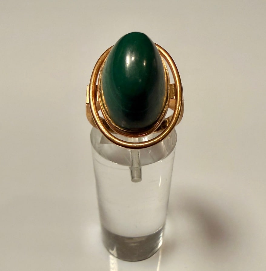 14K Gold And Malachite Ring: Ring size 6 3/4. Marked 585 14K. Approx. gross weight 10.0 grams. STERLING ASSOCIATES STRIVES TO PROVIDE ACCURATE, OBJECTIVE, & FAIR INFORMATION ONALL LOTS. WE WILL BE HAPPY TO ANSWER ANY QUESTIONS AN