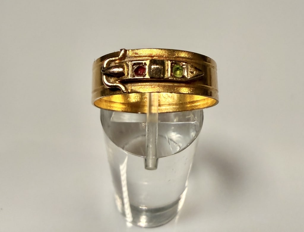 14K Gold Russian Belt Form Ring: Small colored stones. Ring size 9 1/4. Marked 56 for 14K and hallmarks. Approx. gross weight 2.6 grams. STERLING ASSOCIATES STRIVES TO PROVIDEACCURATE, OBJECTIVE, & FAIR INFORMATION ON ALL LOTS. WE WI