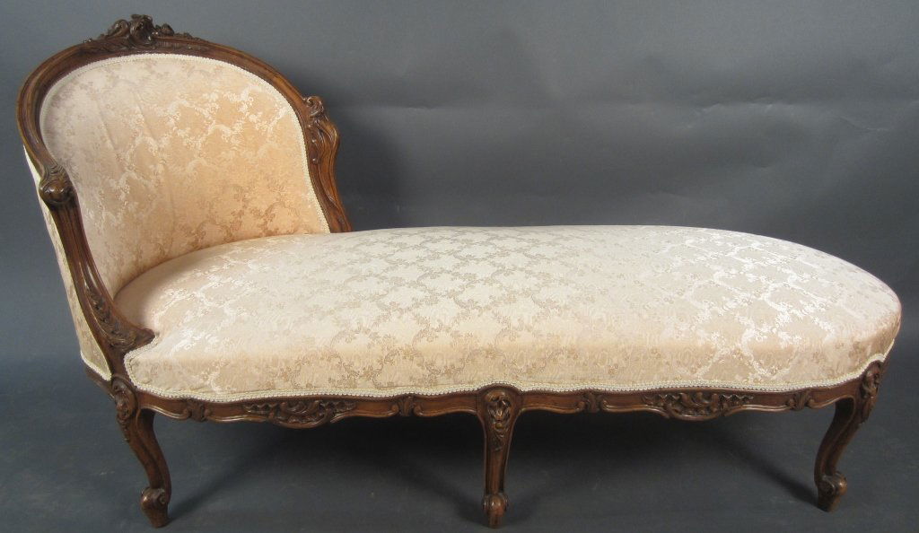 Louis XV Style Walnut Chaise: Louis XV style walnut chaise, French 19th Century Height: 34 1/2", Width: 57"