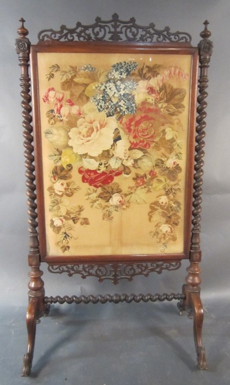 Needlepoint Victorian Fire Screen: Carved wood fire screen with barley twist columns and center needlepoint panel. Victorian circa 1880 Height: 57" Width: 30 1/2"