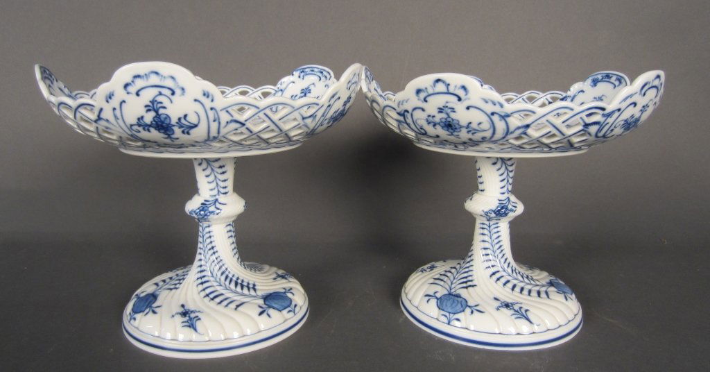 Pair of "Onion" Pattern Meissen Tazzas: Pair of Meissen Tazzas. Reticulated bowls on pedestals decorated with blue onion pattern. Maker's mark of 2 crossed swords on bottom.
