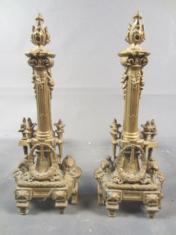 Pair of Bronze Andirons: Pair of bronze andirons. French, Louis XVI style. circa 1900 Height: 20", Width: 9"