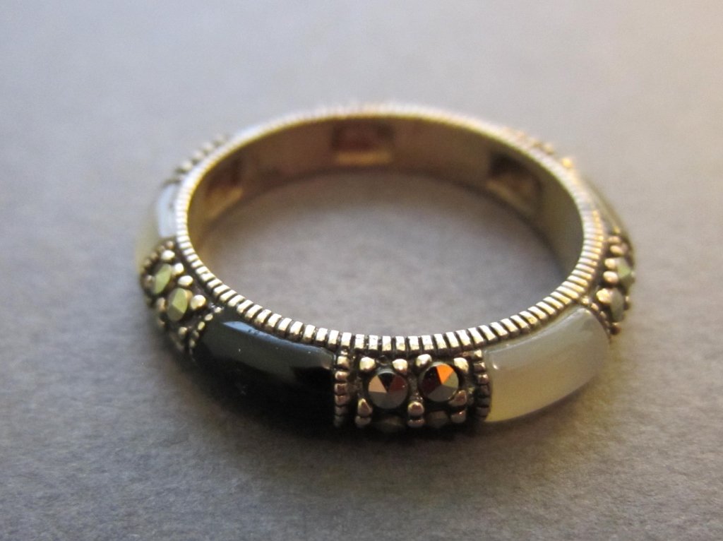Sterling, Marcasite, Mother of Pearl & Onyx Ring: Sterling silver, mother of pearl, onyx, & marcasite ring Marked: 925 Thailand