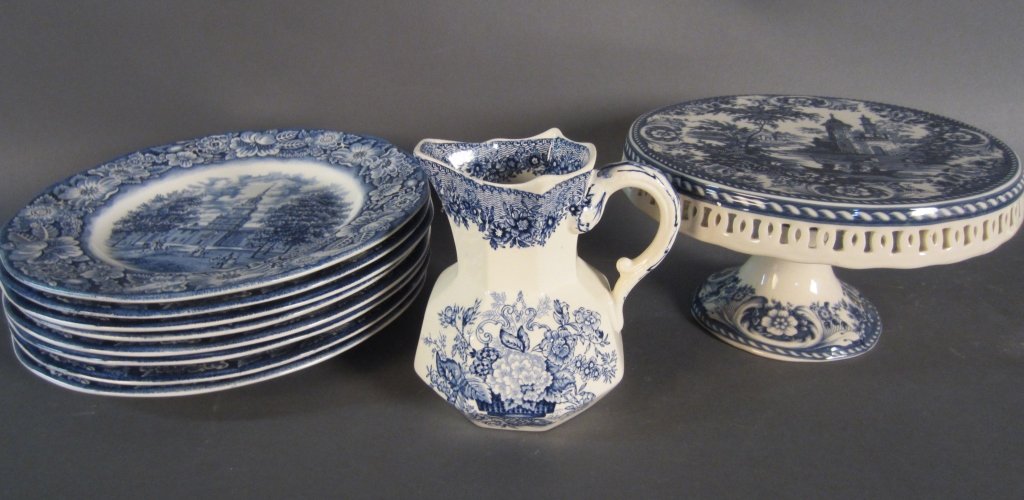 Collection of Blue & White Enameled Porcelain: From the estate of John McDonald Collection of blue and white porcelain including: cake plate, pitcher, and 8 plates, all are English. The cake plate has an old repair.