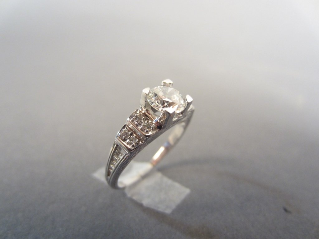 Diamond Ring: Diamond solitaire ring in beautiful art deco setting. GIA Certified