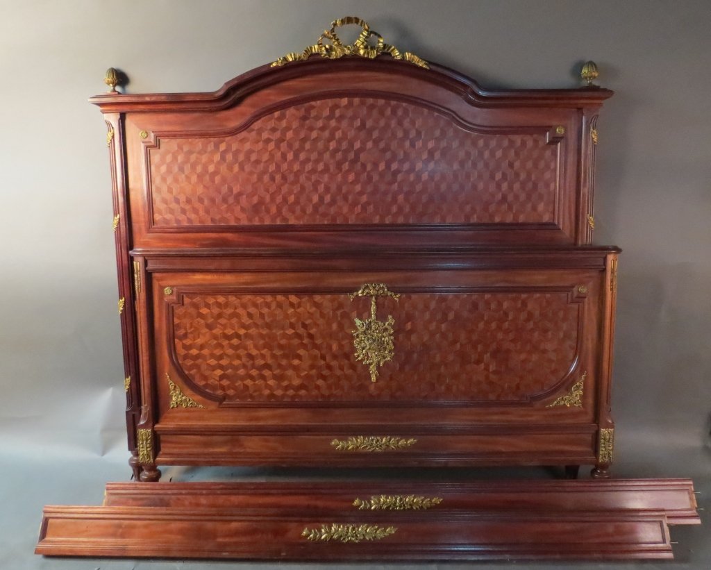 Full Sized Mahogany Bed with Parquetry Design: Full size mahogany bed with beautiful parquetry on both the head and foot board. Bronze mounts and finials decorate the entire bed. Louis XVI style, 19th French. Height: 61", Width: 46"