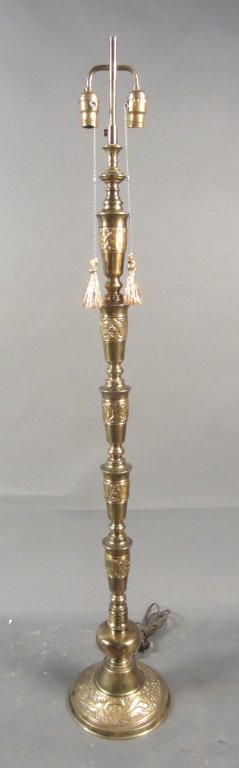 Figural Floor Lamp: Figural bronze floor lamp with winged animal details. two lights. Height: 55 1/2", Width: 9"