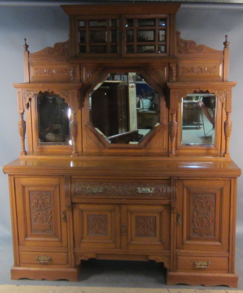East Lake Style Oak Buffet: East Lake style oak buffet with mirrored and beveled panels, circa 1880. 2 pieces Height: 86", Width: 71"