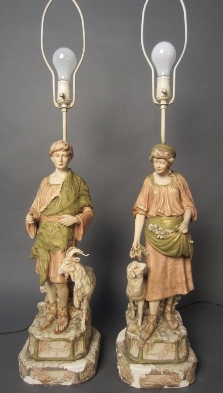 Pair Royal Dux Figures as Lamps: Pair Royal Dux figures as lamps. Male is missing wooden staff and ram has repair to horn. Total height: 37 1/2", Height of figures on base: 22 1/2", Width: 7 1/2"