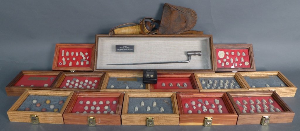 Collection of Civil War Bullets and Weapons: Collection of civil war bullets, display cases, bag and powder horn, and bayonet. These items are Civil War collectibles and possibly reproduction recreations. Height of bayonet case: 8 1/4", Width: 2