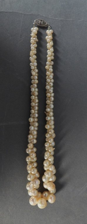 Antique Pearl Necklace: Antique baroque pearl necklace with a fishhook clasp. Length: 14"