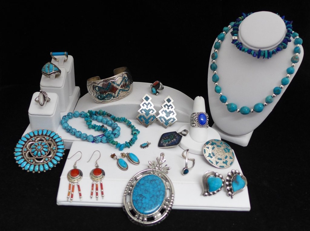Collection of Native American/ Navajo Jewelry: Collection of sterling silver and turquoise Native American/ Navajo style jewelry, including an authentic Navajo Larry Watchman brooch. Approx total weight: 249 grams.
