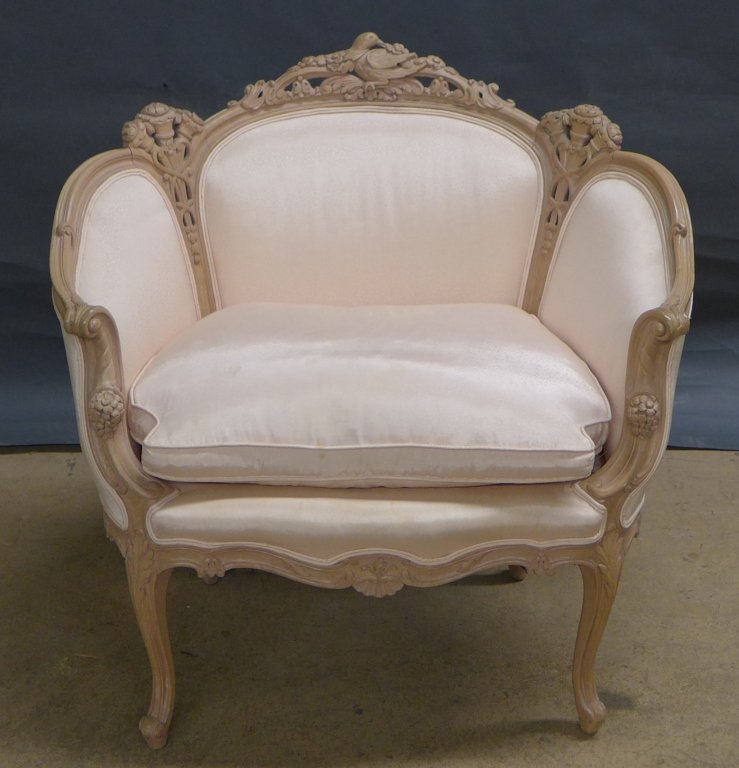 Louis XV Style Bergere Chair: Louis XV style Bergere chair with intricately carved wood frame. Some discoloration to fabric. Height: 35 3/4, Width: 35 1/2", Depth: 28"