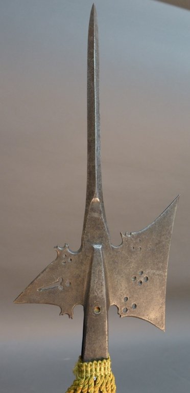 Italian Halberd: Italian halberd, possibly 16th Century. Gothic form iron head w/ slightly recurved cutting edge axe blade & elongated curved front edge. Back spike pierced w/ key motif. Total Length: 94 5/8", Length