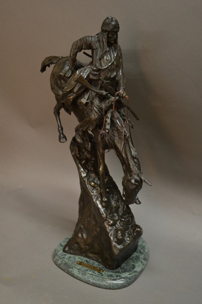 After Frederic Remington, American (1861- 1909): After Frederic Remington, American (1861- 1909) "The Mountain Man" Patinated bronze sculpture on marble base. Bronze signed: Copyright by Frederic Remington. Plaque reads: The Mountain Man, Frederic R