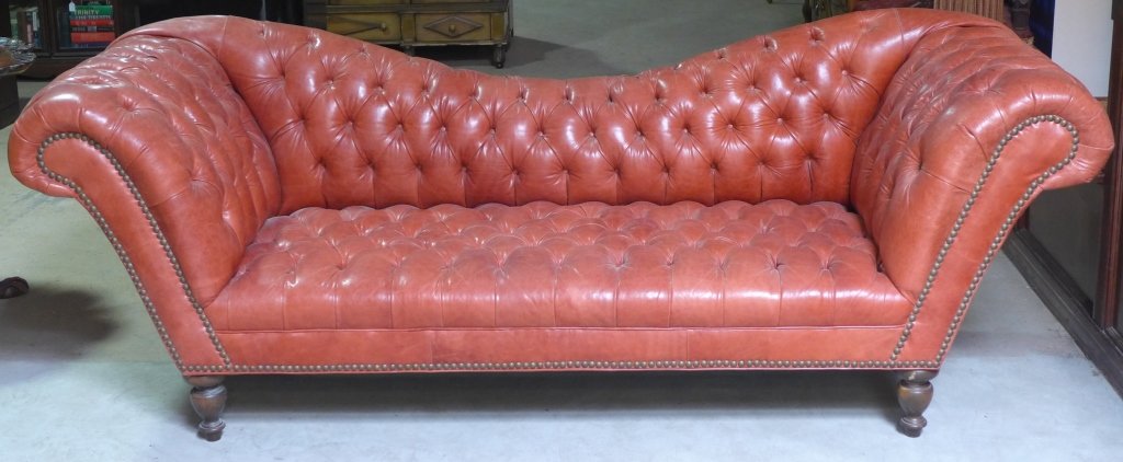 Tufted Leather Sofa: Coral tufted leather sofa with nail head design. Height: 33", Width: 94", Depth: 32"