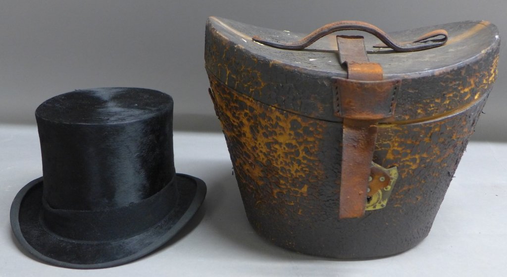 Top Hat and Case: Victorian top hat made by Young Bros, New York. Fitted leather traveling case has age appropriate ware. Height of case: 10 5/8", Width: 13 3/4", Depth: 13"