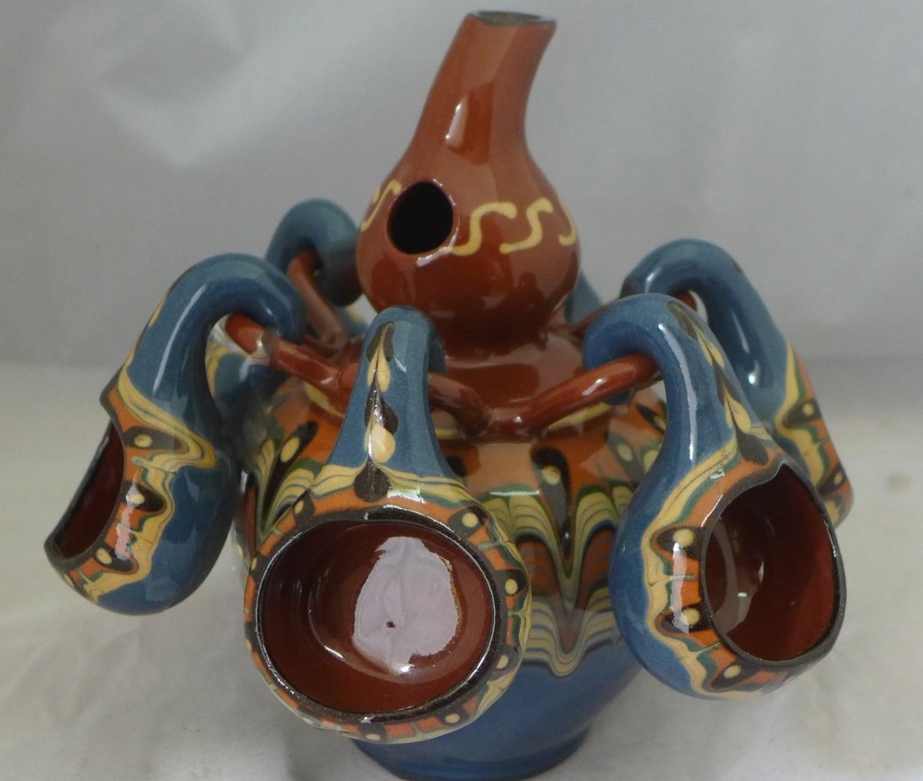 Spouted Vase with Cups: Beautiful spouted ceramic vase with 6 hanging cups. Height: 7", Width: 7 1/4"
