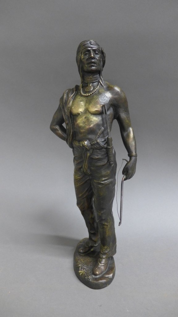 Figural Patinated Bronze: Figural patinated bronze of a Native American/ Indian complete with bow and arrows. Height: 11 1/2", Width: 6"
