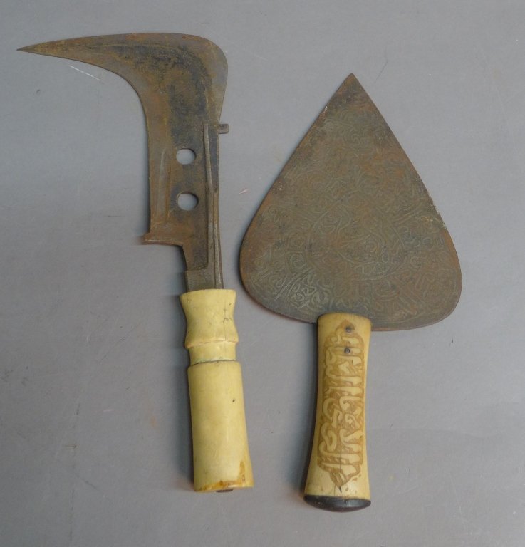 Pair of African Blades with Carved Handles: Possible Ivory or bone carved handles on an African sickle and dagger. Dagger blade is carved. Surface rust to blades. Height: 12 1/2", Width: 6", Depth: 1 1/4"