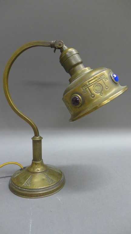 Arts and Craft Lamp, Jeweled Shade: From the Estate of Mark Falk. Arts and Crafts Brass/bronze desk lamp with jeweled brass shade. Adjustable. Height: 11 1/2", Width: 10"