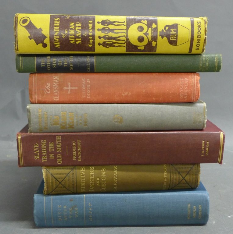 Collection of Vintage Slavery & KKK Books: From the Estate of Mark Falk. A collection of 7 Books related to Slavery and the Klu Klux Klan. Titles include: The Clansmen, Primitive Manners and Customs, Adventures of an African Slaver, Dixie afte