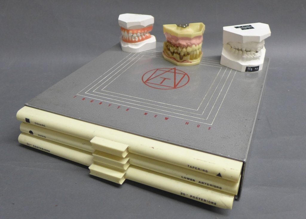 Anatomical Dental Models: From the Estate of Mark Falk. Collection on teeth molds, including a tooth hygiene model and a Vintage Vintage Trubyte New Age Tooth Guide Guide. This sample case comes with 3 drawers of plastic teeth